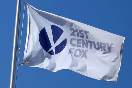 FILE PHOTO: The Twenty-First Century Fox Studios flag flies over the company building in Los Angeles, California U.S. November 6, 2017. REUTERS/Lucy Nicholson/File Photo