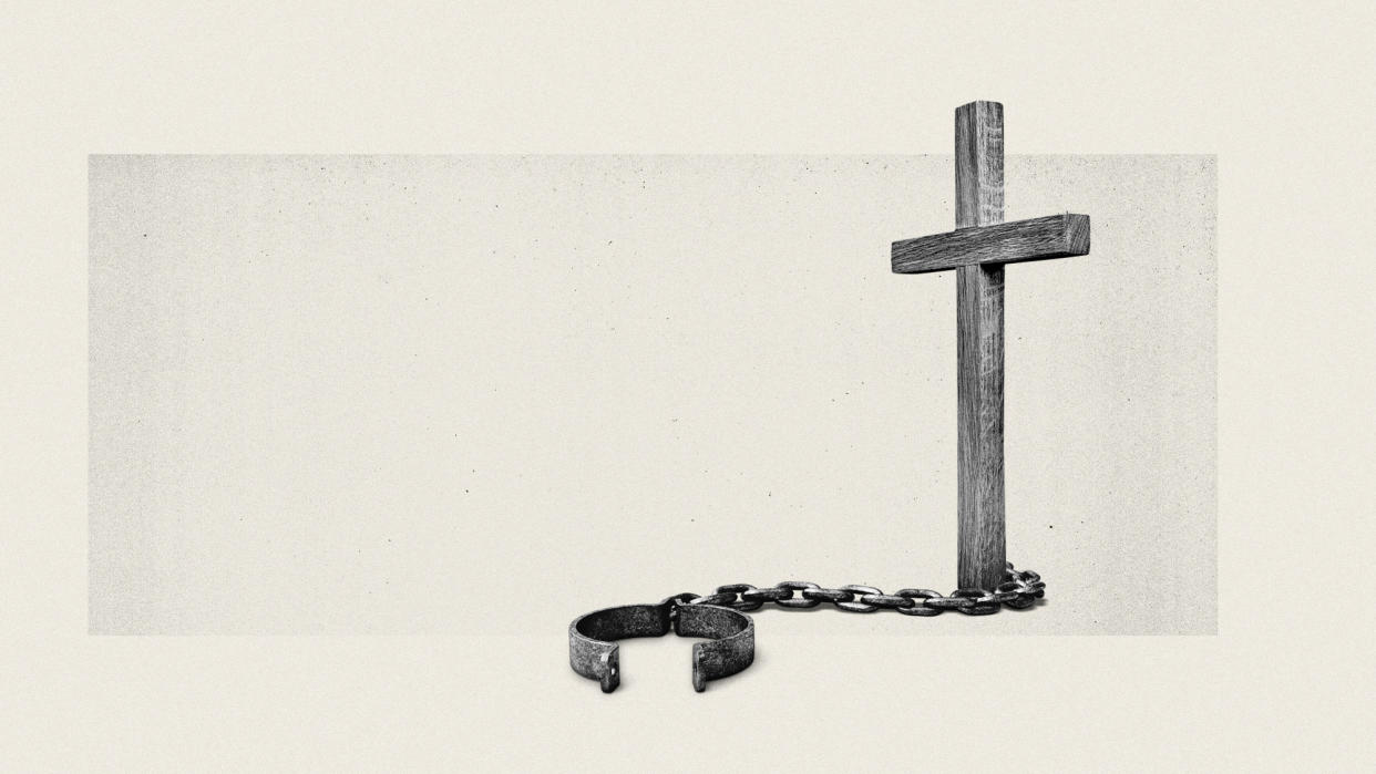  Photo composite of a crucifix with a manacle and chain attached. 