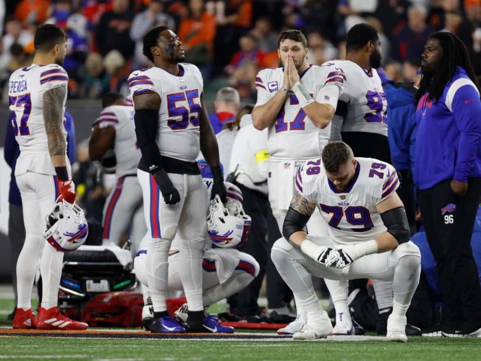 Buffalo Bills players react after teammate Damar Hamlin was injured against the Cincinnati Bengals during the first quarter at Paycor Stadium on January 02, 2023 in Cincinnati, Ohio. (Photo by Kirk Irwin/Getty Images) (Kirk Irwin/Getty Images - image credit)