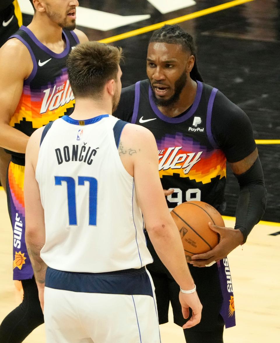 May 2, 2022; Phoenix, Arizona, USA; Phoenix Suns forward Jae Crowder (99) talks with Dallas Mavericks guard Luka Doncic (77) during game one of the NBA Western Conference semifinals at Footprint Center.