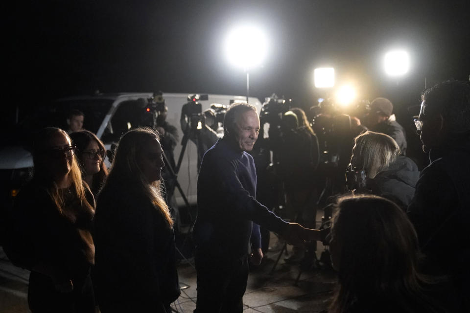 Uri Raanan, center, thanks reporters for coming to his Bannockburn, Ill., home, after his daughter Natalie and her mother Judith Raanan were released by Hamas, Friday, Oct. 20, 2023. (AP Photo/Charles Rex Arbogast)