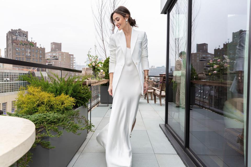 On our terrace in a Dannijo bridal slip, bangles, and earrings. This pic was taken before an intimate legal ceremony in New York City with our immediate family. The couple who set us up officiated which made it really special.