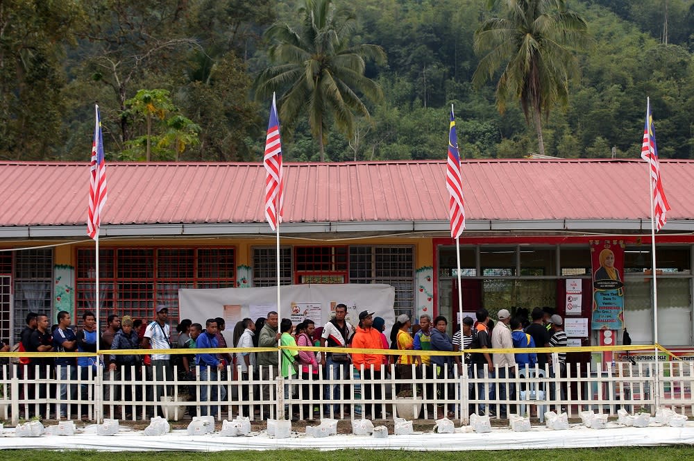 People wait in line to cast their votes at SK Menson in Cameron Highlands January 26, 2019. — Picture by Farhan Najib