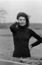 <p>So simple, but so stylish: Jackie wears just tweed pants and a black knit turtleneck paired with her Cartier Tank watch. <br></p>