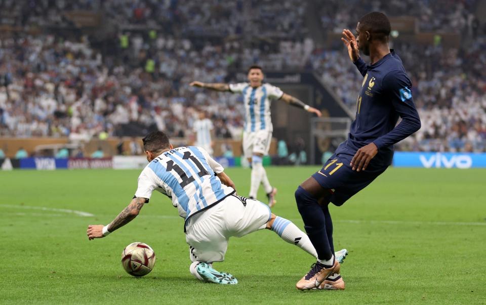 Angel Di Maria of Argentina is fouled by Ousmane Dembele of France - Catherine Ivill/Getty Images