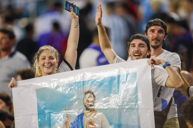 Argentina fans hold an image of Lionel Messi as Jesus Christ during the game against Honduras on Sept. 23, 2022 at Hard Rock Stadium in Miami, Florida. (Sam Navarro-USA TODAY Sports)