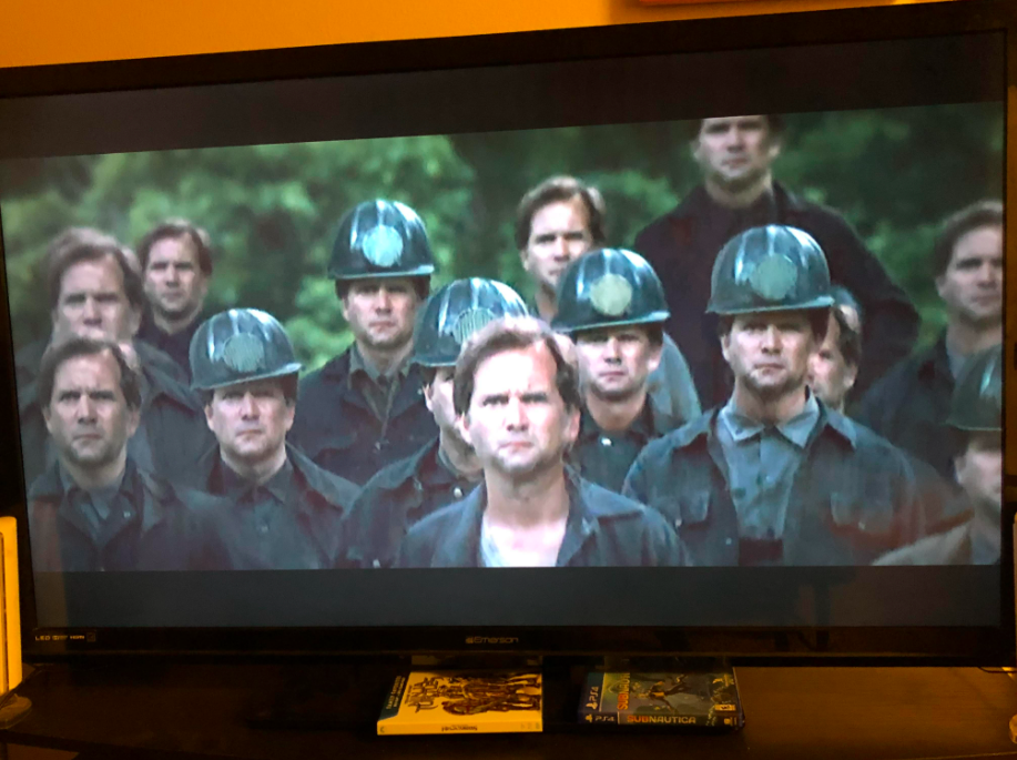 All the miners have the same face, and it's the face of Katniss's father