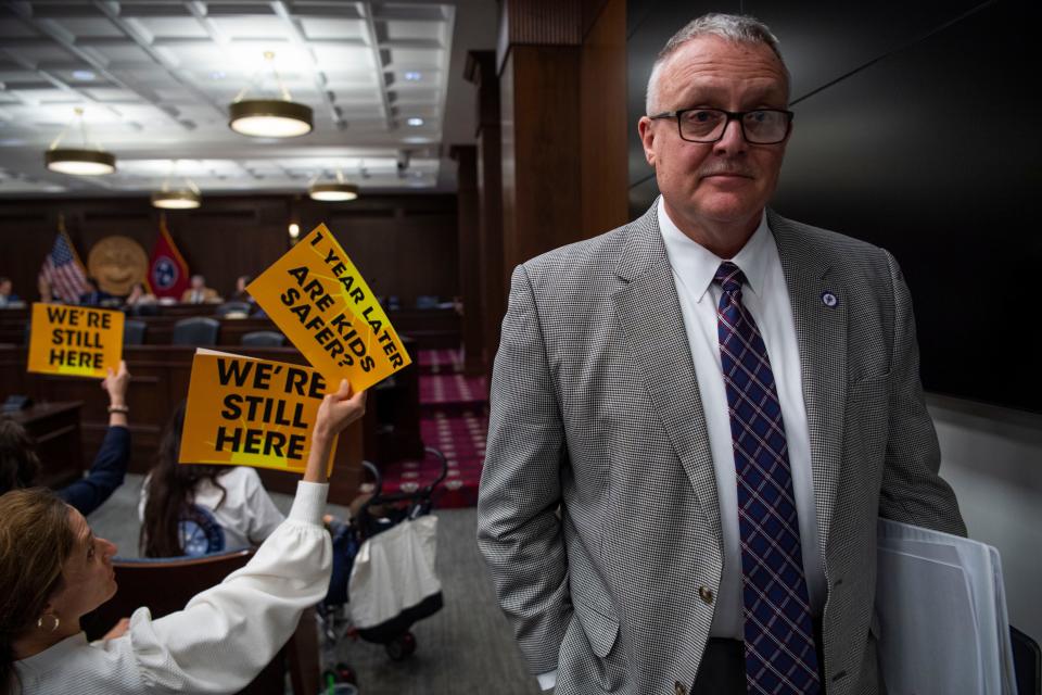 Rep. Monty Fritts, R-Kingston, walks by protesters after presenting his bill during a House committee meeting at Cordell Hull State Office Building in Nashville, Tenn., Tuesday, April 9, 2024.