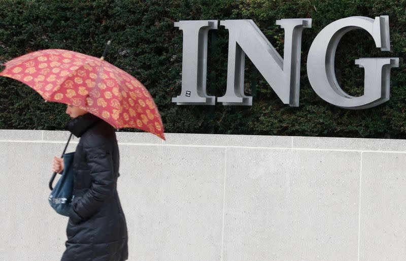 A pedestrian walks past the logo of ING bank by the group's main office in Brussels