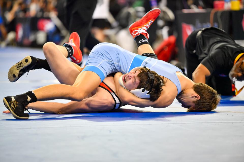 Buckeye state champion Colyn Limbert, top, has a business-first attitude this week at the Junior Freestyle National Championships in Fargo, N.D.