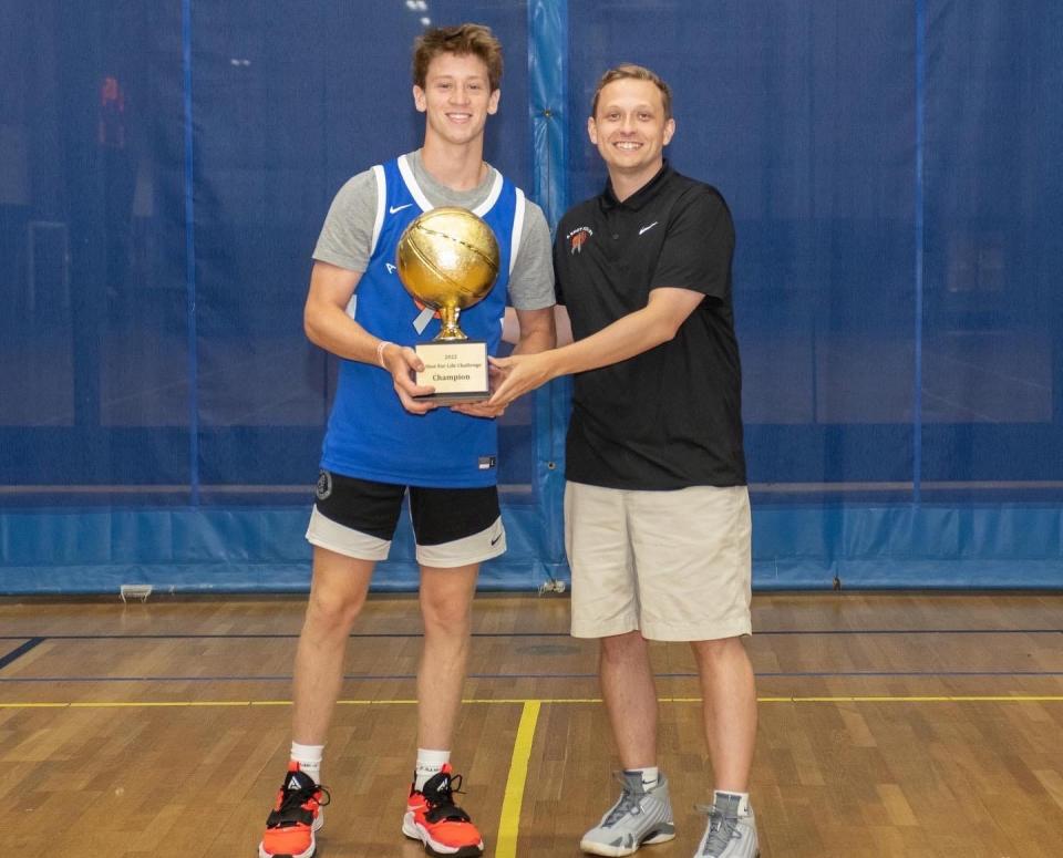 A Shot for Life founder and CEO Mike Slonina (right) with boys shooting champion and Wellesley resident Trevor Mullin of St. Sebastian's School. Mullin shot 87% from the field to win.