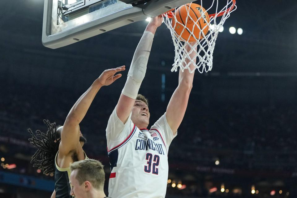 Connecticut center Donovan Clingan dunks against Purdue during the first half of the men's 2024 national championship game at State Farm Stadium in Glendale, Arizona on April 8, 2024.