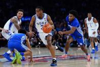 Duke's Jeremy Roach (3) drives past Kentucky's Sahvir Wheeler during the first half of an NCAA college basketball game Tuesday, Nov. 9, 2021, in New York. (AP Photo/Frank Franklin II)