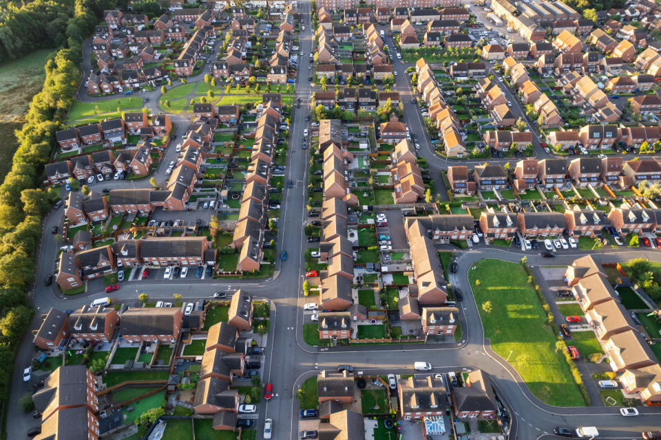 Top down aerial view of houses and streets in a residential area UK New Build Estate Agent House Prices 2022