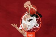 <p>China's Shao Ting goes to the basket in the women's quarter-final basketball match between China and Serbia during the Tokyo 2020 Olympic Games at the Saitama Super Arena in Saitama on August 4, 2021. (Photo by Aris MESSINIS / POOL / AFP)</p> 