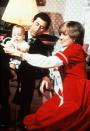 <p>Princess Diana and Prince Charles with a young Prince William at Kensington Palace around Christmastime.</p>