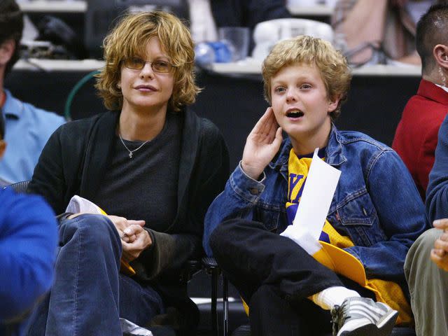 <p>Vince Bucci/Getty </p> Meg Ryan and son Jack Quaid attend an NBA game in April 2004.