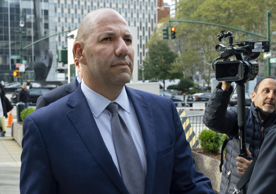 FILE- In this Oct. 17, 2019 file photo, David Correia walks from federal court in New York. Correia and his business partner Lev Parnas, were charged with defrauding investors in a business called "Fraud Guarantee." On Thursday, Sept. 17, 2020 a superseding indictment brought by federal prosecutors also charged them with additional campaign finance violations. (AP Photo/Craig Ruttle)