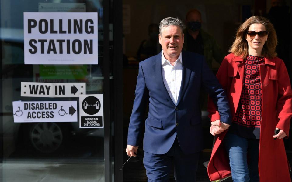 Sir Keir Starmer and his wife Victoria leave after casting their vote - PA