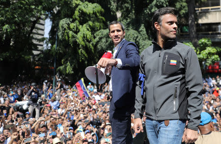 Venezuelan opposition leader Juan Guaido, who many nations have recognised as the country's rightful interim ruler and fellow opposition leader Leopoldo Lopez address a crowd of supporters in Caracas, Venezuela April 30, 2019. REUTERS/Manaure Quintero