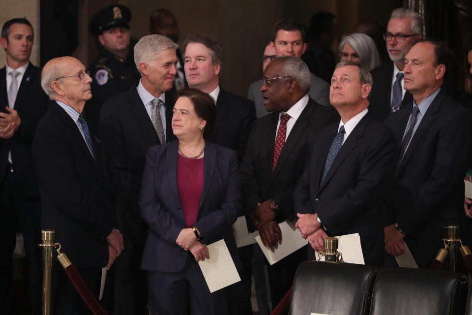 Supreme Court Justices Stephen Breyer, Neil Gorsuch, Elena Kagan, Brett Kavanaugh, Clarence Thomas, John Roberts and&nbsp;Samuel Alito await the arrival of Bush's casket inside the Capitol Rotunda.