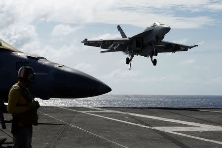 An F/A-18 Super Hornet lands on the deck of the USS Ronald Reagan at the South China Sea September 30, 2017. REUTERS/Bobby Yip