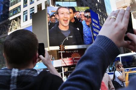 Facebook Inc. CEO Mark Zuckerberg is seen on a screen televised from their headquarters in Menlo Park moments after their IPO launch in New York May 18, 2012. REUTERS/Shannon Stapleton