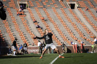 Clemson quarterback Trevor Lawrence (16) warms up with his team before an NCAA college football game against Pittsburgh Saturday, Nov. 28, 2020, in Clemson, S.C. (Ken Ruinard/Pool Photo via AP)