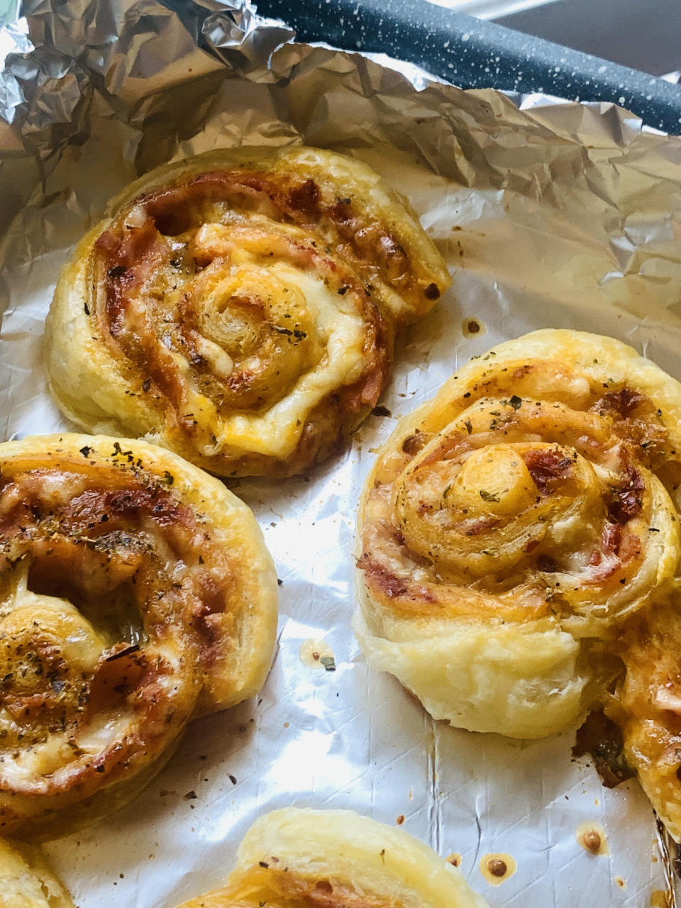 Homemade pizza puff pastry pinwheels.