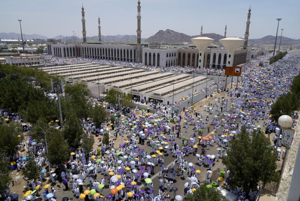 Muslim pilgrims move on their way to perform Friday Prayers at Namira Mosque in Arafat, on the second day of the annual hajj pilgrimage, near the holy city of Mecca, Saudi Arabia, Friday, July 8, 2022. (AP Photo/Amr Nabil)