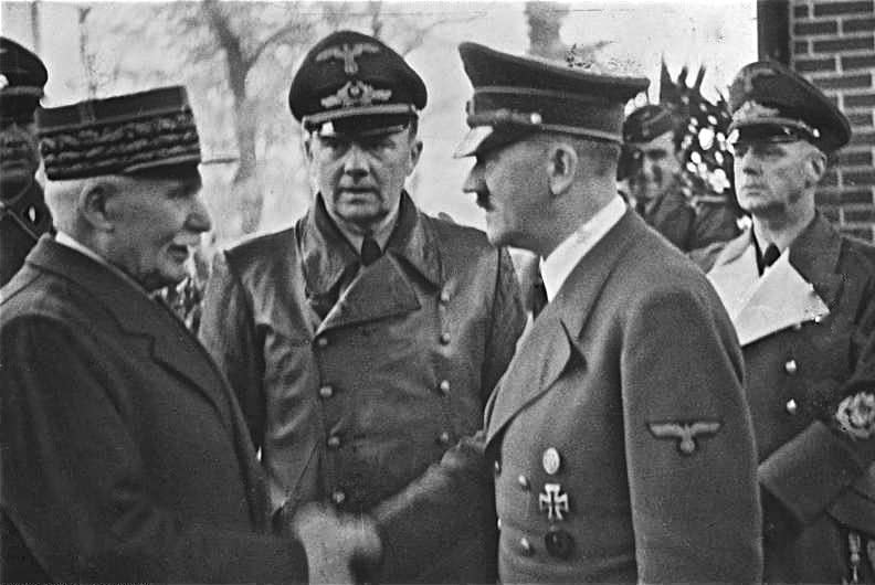 Vichy, France, Marshal Philippe Petain (L) greets Nazi leader Adolf Hitler in 1940. On November 10, 1942, Nazi troops entered previously unoccupied France, the de facto government of which was centered in Vichy state. Vichy was seen as a puppet government controlled by Germany. File Photo courtesy the German Federal Archive