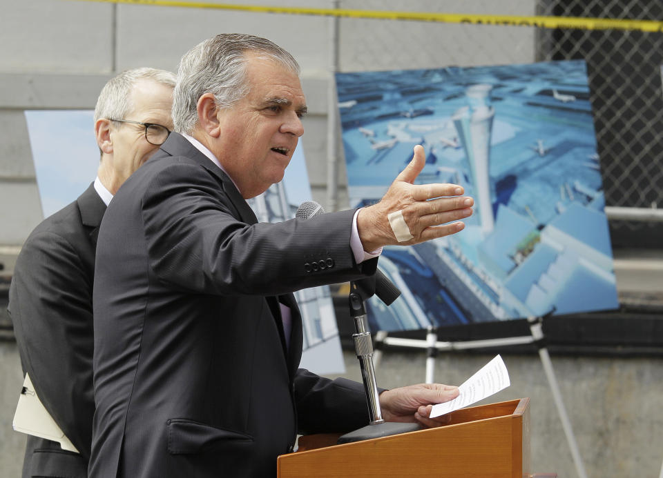 U.S. Transportation Secretary Ray LaHood gestures while speaking during a groundbreaking ceremony for a traffic control tower at San Francisco International Airport Monday, July 9, 2012 in San Francisco. The airport is getting a new control tower with a unique design that resembles a torch, not the traditional lollipop shape of other towers. The FAA expects to start using the 221-foot tall facility in 2015. At left is airport director John L. Martin. (AP Photo/Eric Risberg)