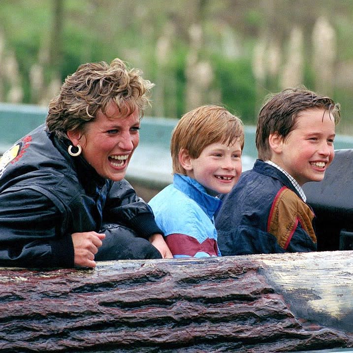  Princes William and Harry with their mother, Diana, Princess of Wales (1961 - 1997) in the garden of Highgrove House in Gloucestershire, 18th July 1986. William is wearing a Dallas Cowboys t-shirt. 