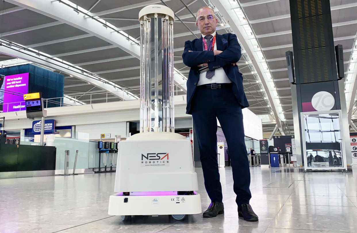Stan (Duty Manager for Mitie - Hygiene Services at Heathrow) and Victoria (UVD Robot) on Heathrow: Britain's Busiest Airport. (ITV)
