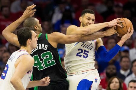 May 7, 2018; Philadelphia, PA, USA; Philadelphia 76ers guard Ben Simmons (25) rebounds the ball past Boston Celtics forward Al Horford (42) during the first quarter in game four of the second round of the 2018 NBA Playoffs at Wells Fargo Center. Mandatory Credit: Bill Streicher-USA TODAY Sports