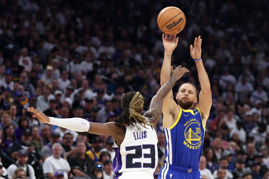 Stephen Curry shoots over Keon Ellis of the Sacramento Kings in the first quarter during the Play-In Tournament at Golden 1 Center on April 16, 2024 in Sacramento. (Photo by Ezra Shaw/Getty Images)