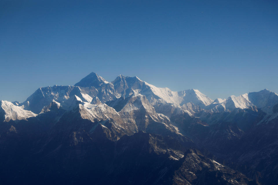 Mount Everest, the world's highest peak, and other peaks of the Himalayan range are seen through an aircraft window during a flight from Kathmandu, Nepal, January 15, 2020. / Credit: Reuters/Monika Deupala