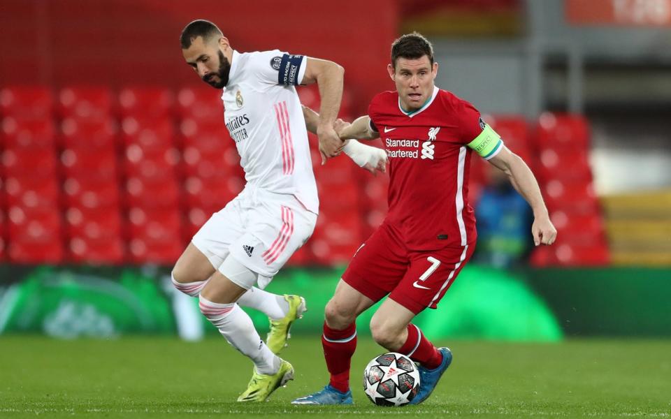 Karim Benzema of Real Madrid battles for possession with James Milner of Liverpool during the UEFA Champions League Quarter Final Second Leg match between Liverpool FC and Real Madrid - Jan Kruger - UEFA 