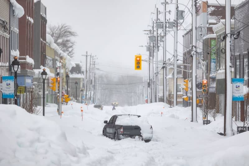 A truck is abandoned on a snow-covered street after a winter storm in Sydney. A local state of emergency remained in effect in parts of Cape Breton on Monday, as Nova Scotia dug out from one of the heaviest snowfalls in 20 years. Shane Wilkie/Canadian Press via ZUMA Press/dpa