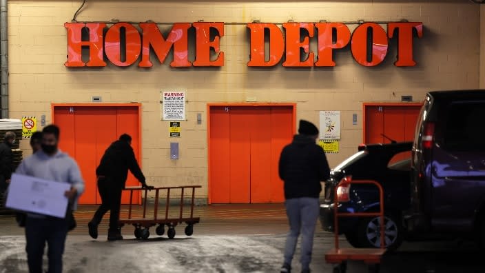 Customers walk through the parking lot of a Home Depot store in the Sunset Park neighborhood of Brooklyn in New York City. (Photo: Michael M. Santiago/Getty Images)