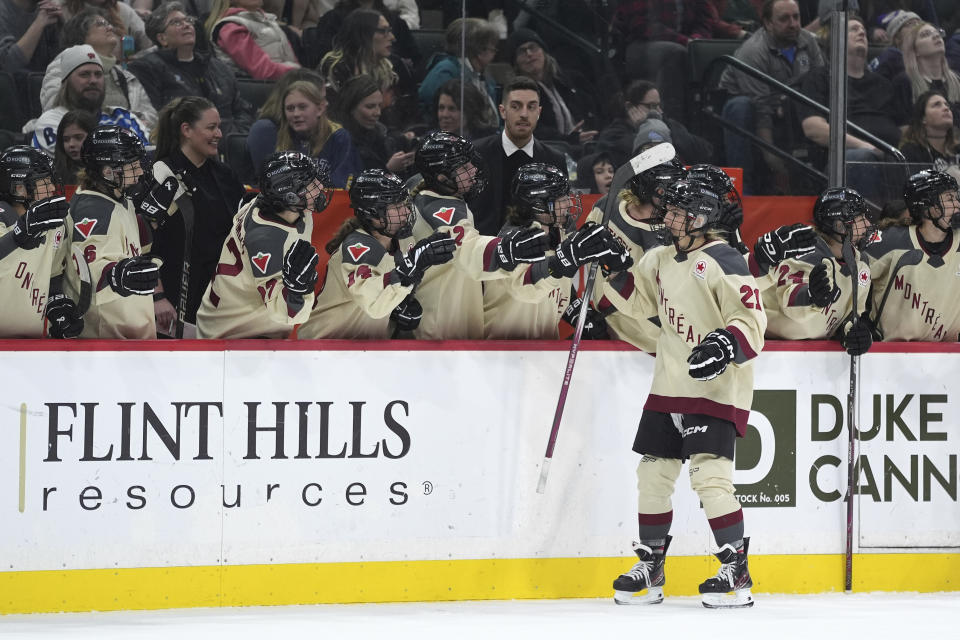 Montreal forward Tereza Vanišová (21) celebrates with teammates after scoring during the third period of a PWHL hockey game against Minnesota, Wednesday, Jan. 24, 2024, in St. Paul, Minn. (AP Photo/Abbie Parr)