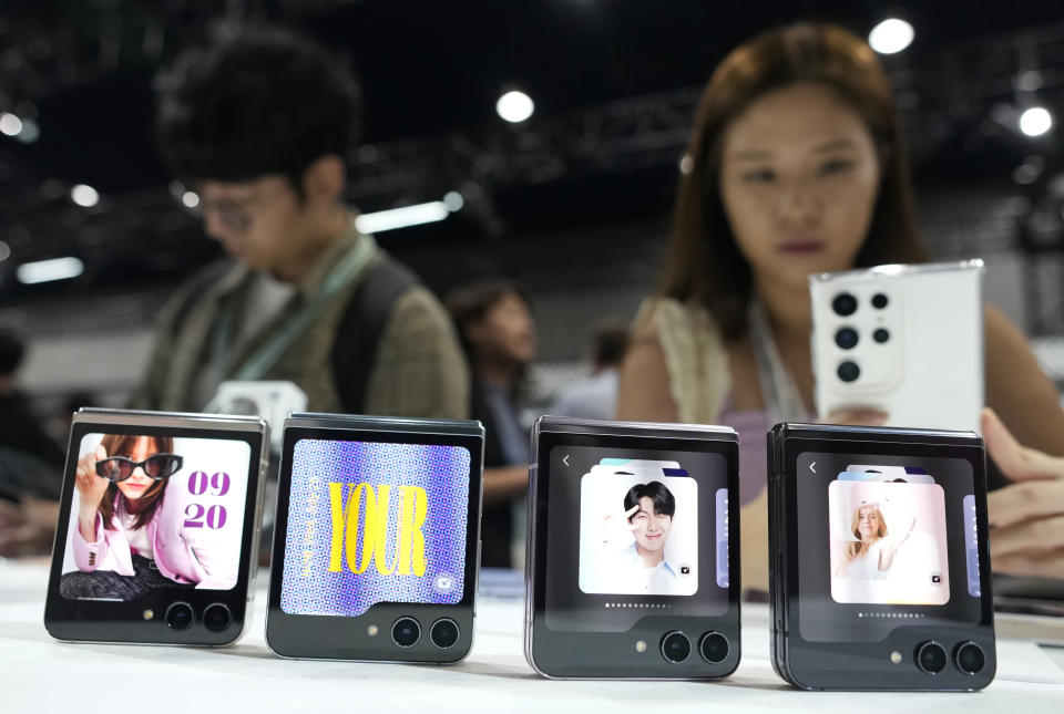 Samsung Galaxy Z Flip 5 Phones displayed during the Galaxy Unpacked 2023 event at the COEX in Seoul, South Korea, Wednesday, July 26, 2023. Samsung Electronics on Wednesday unveiled two foldable smartphones as it continues to bet on devices with bending screens, a budding market that has yet to fully take off because of high prices. (AP Photo/Ahn Young-joon)