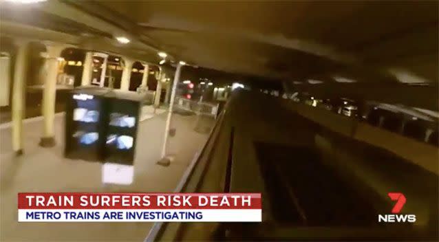 Footage of the train surfing at Flinders Street Station. Source: 7News