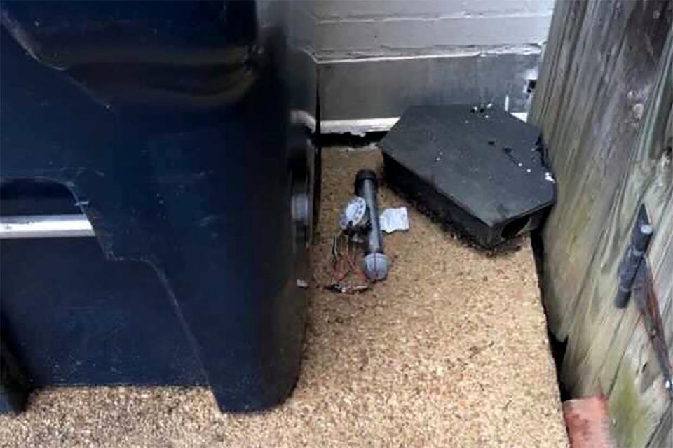 In this Jan. 6, 2021 photo, an explosive device is shown outside of the Republican National Committee office in Washington. The FBI has released new video showing someone placing two pipe bombs outside the offices of the Republican and Democratic national committees the night before the Jan. 6 riot at the U.S. Capitol. (AP)