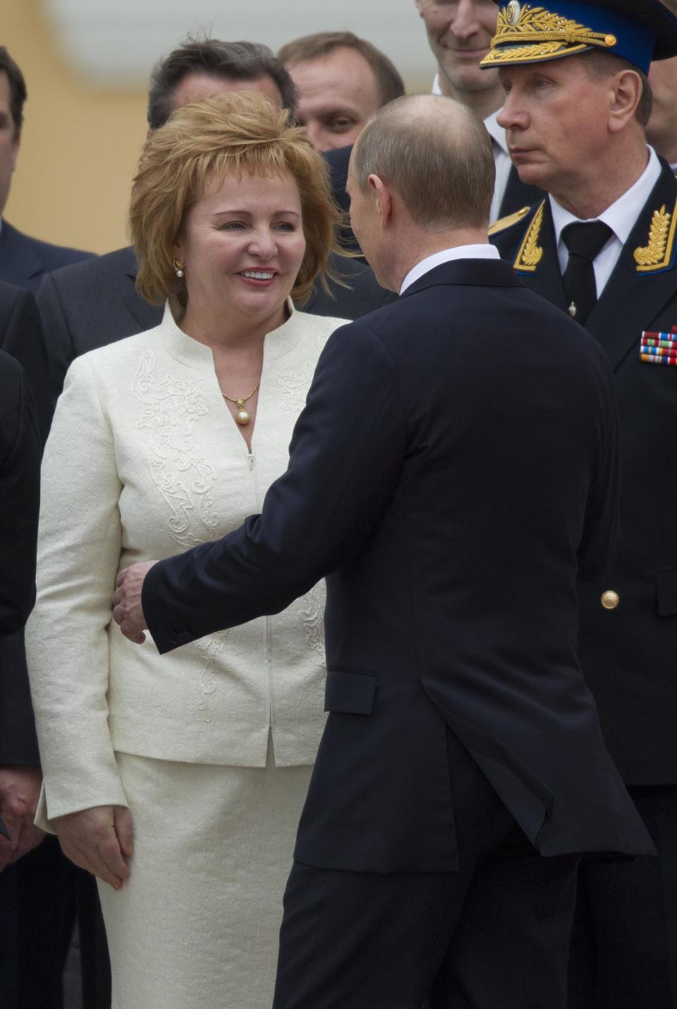 FILE - In this Monday, May 7, 2012 Russian President Vladimir Putin, right, greets his wife Lyudmila during an inauguration ceremony at the Cathedral Square in the Kremlin in Moscow, Russia. Russian President Vladimir Putin and his wife Lyudmila have announced they are divorcing. Married just a few weeks short of 30 years, the Putins announced the decision on state television after attending a ballet performance Thursday evening in the Kremlin. (AP Photo/Alexander Zemlianichenko, file)