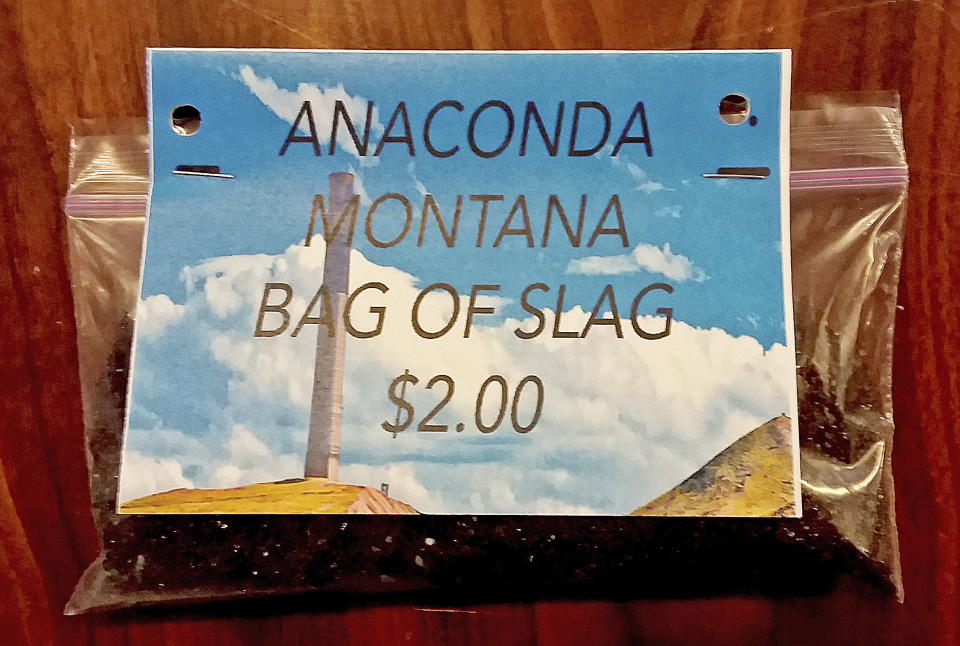 In this undated photo provided by the Anaconda Chamber of Commerce, a bag of mining slag that was available for purchase as a souvenir at the Anaconda Chamber is seen. Environmental regulators have put a halt to a Montana business association’s sale of sandwich bags of mining waste advertised as a "Bag O'Slag." Environmental Protection Agency officials overseeing the Superfund site cleanup of pollution from nearly a century of smelting operations in Anaconda came across the potentially toxic tchotchkes for sale by the city’s chamber of commerce. The slag, a byproduct of smelting copper, contains small amounts of arsenic and lead. (Mary Johnston/Anaconda Chamber of Commerce via AP)