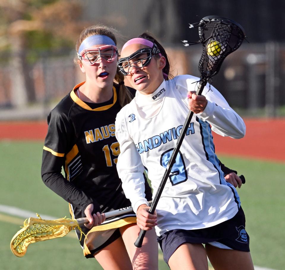 Sophia Visceglio of Sandwich runs with Julia Kipperman of Nauset on Thursday, May 4, 2023.