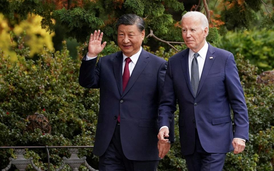 Xi Jinping walks with Joe Biden at the Asia-Pacific Economic Cooperation summit, in California on November 15