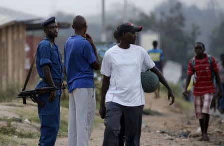 Burundi police patrol the streets of Musaga district in the capital Bujumbura after the results of this weeks presidential elections were released, July 24, 2015. REUTERS/Mike Hutchings