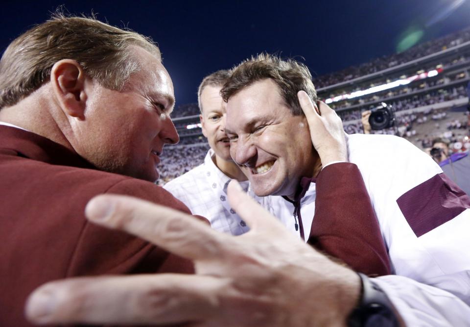 Scott Stricklin, left, has been Mississippi State's athletic director since 2010. (AP Photo/Rogelio V. Solis)